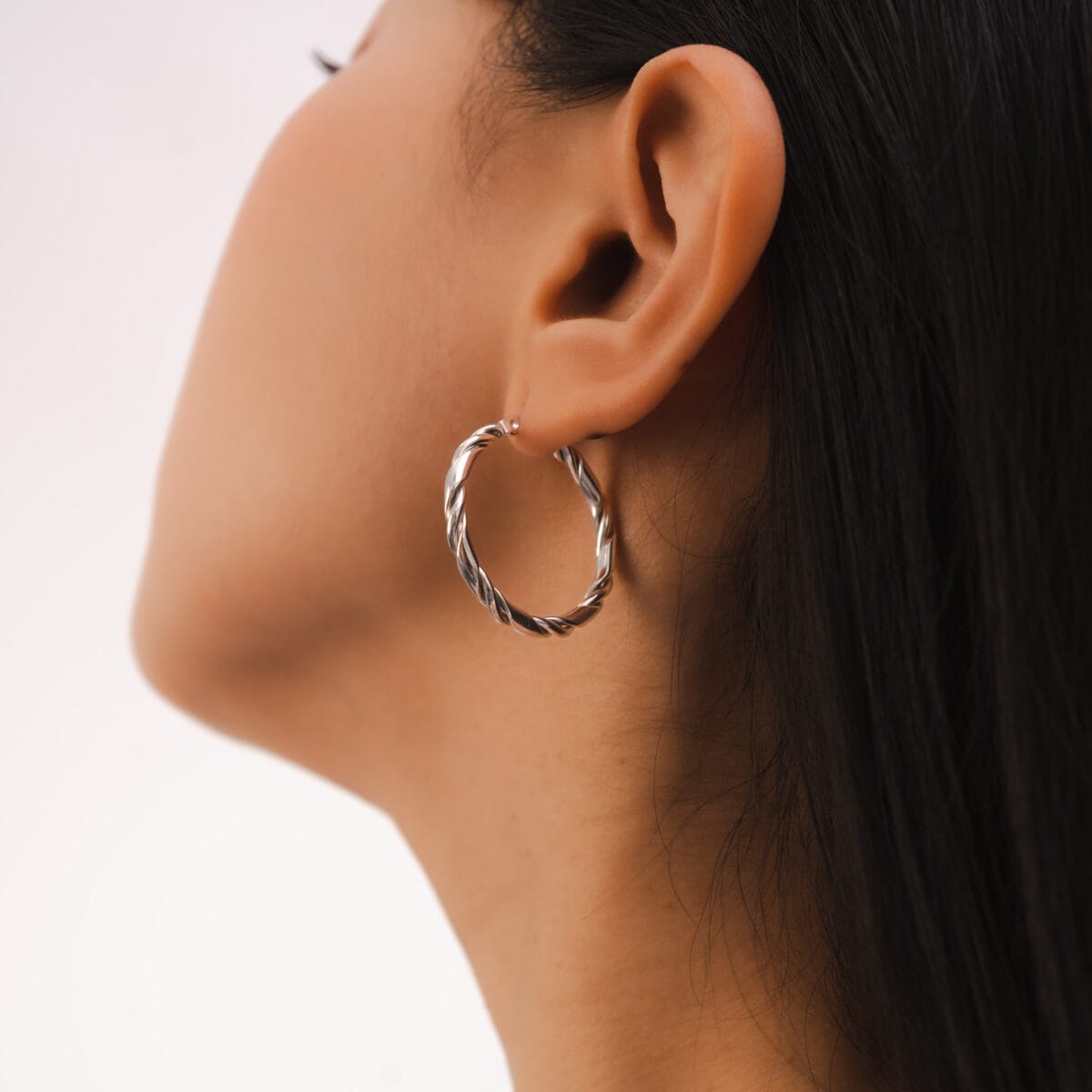 https://m.clubbella.co/product/kila-swirl-earrings/ Kila Swirl Hoop Earrings (1)