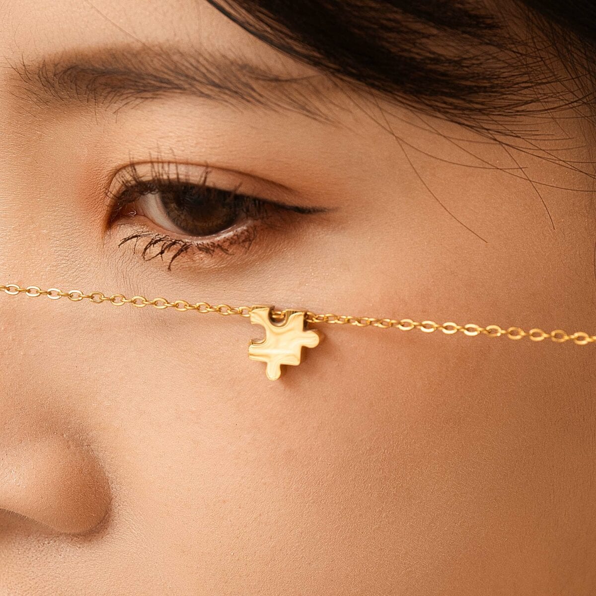https://m.clubbella.co/product/duna-gold-puzzle-charm-necklace/ Duna Puzzle Gold Charm Bracelet (1)
